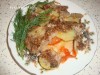 Свинина с овощами, запеченная под огуречно-ореховым соусом